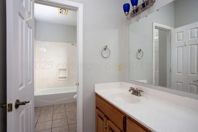 a bathroom with a toilet and a bathtub