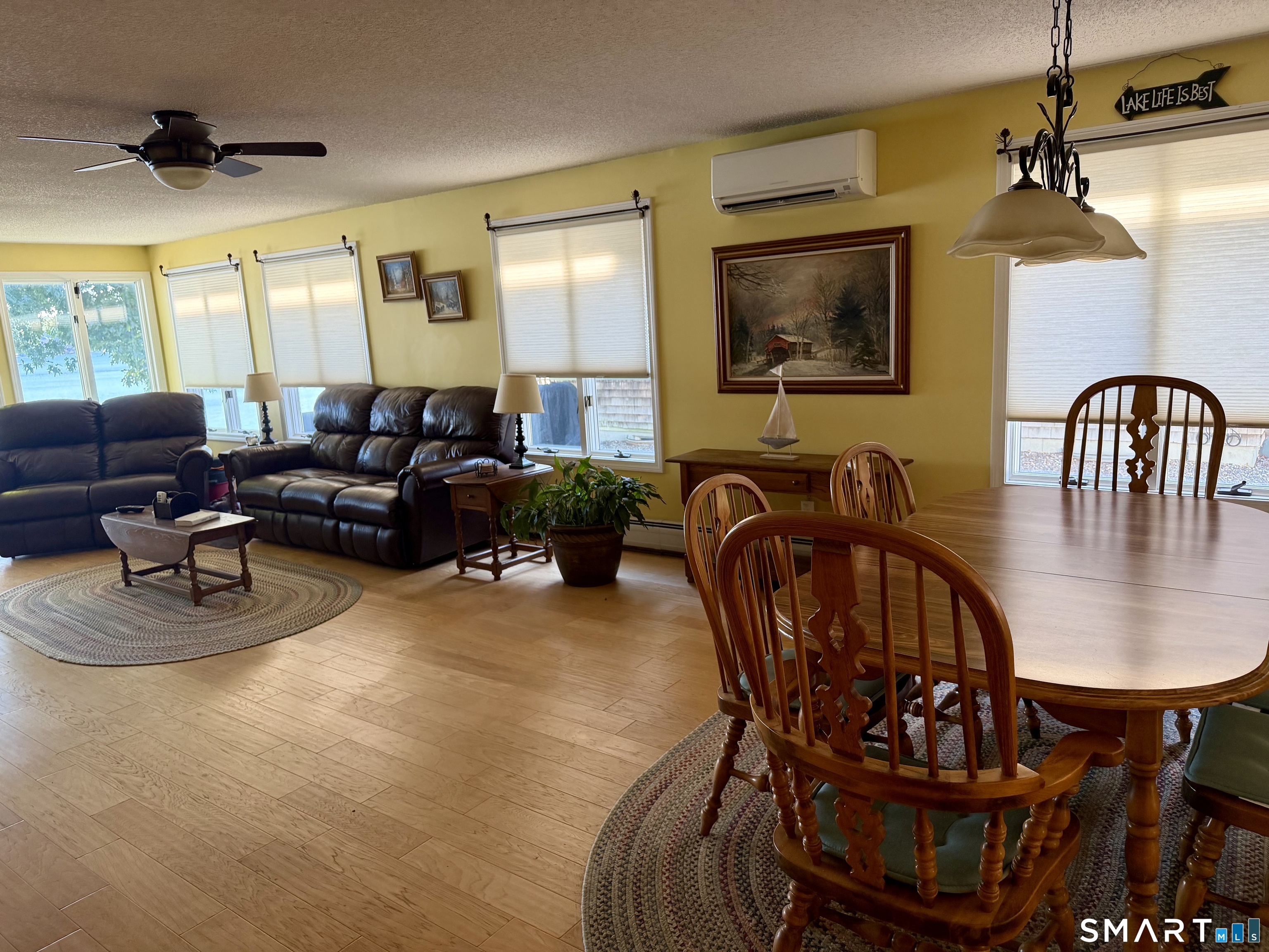 204 Pine Hollow Road Killingly, CT 06241 - Photo 11 of 20 The open living and dining area is comfortable, bright and designed for easy lake living. Large windows bring in natural light and glimpses of Alexander's Lake, while the Mitsubishi mini-split provides efficient heating and air-conditioning