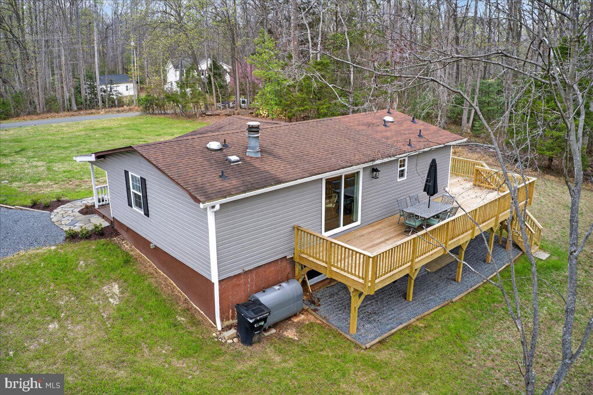 66 Ordinary Road Mineral, VA 23117 - Photo 2 of 96 a aerial view of a house with a yard table and chairs