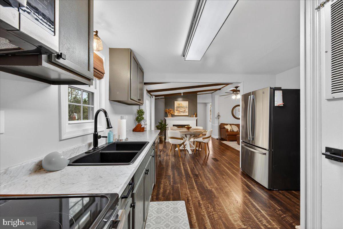 66 Ordinary Road Mineral, VA 23117 - Photo 25 of 96 a kitchen with stainless steel appliances granite countertop a sink a stove and refrigerator