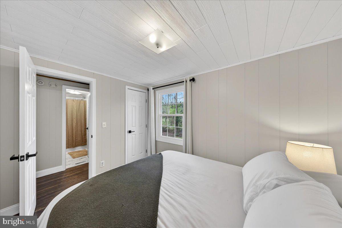 66 Ordinary Road Mineral, VA 23117 - Photo 28 of 96 a bedroom with a bed and a large window