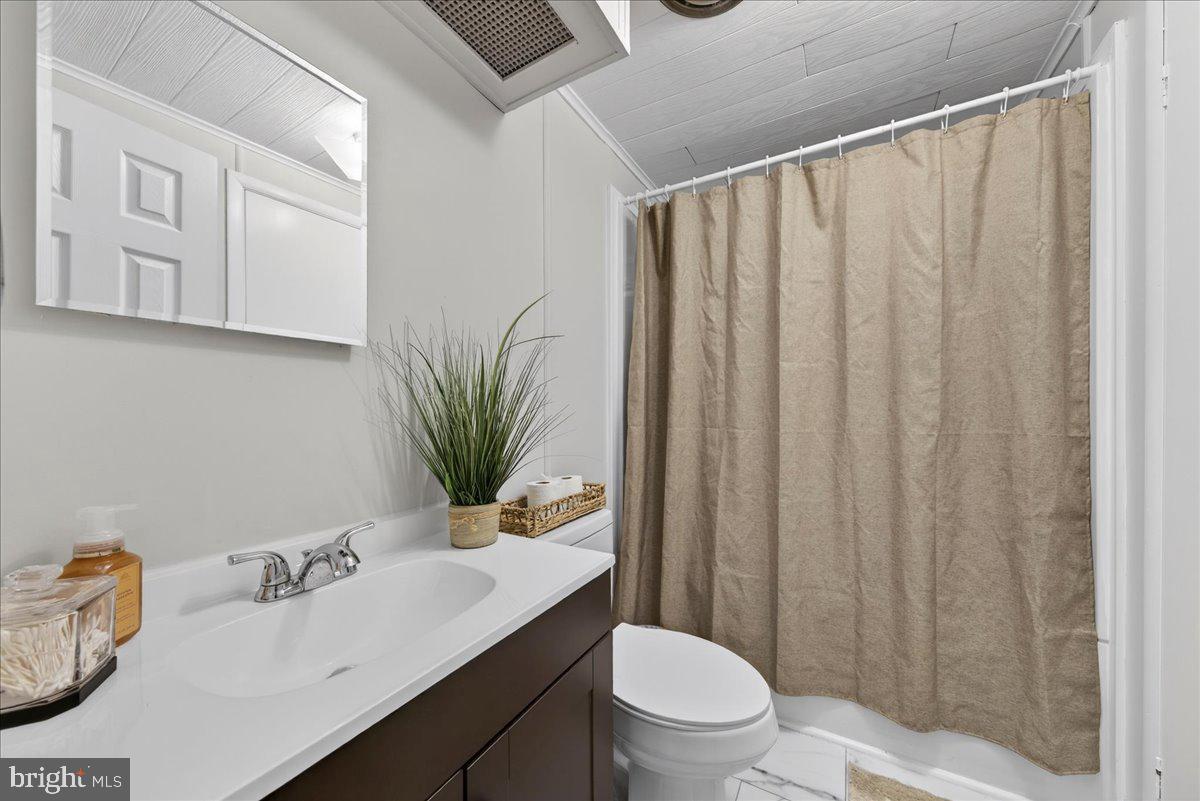 66 Ordinary Road Mineral, VA 23117 - Photo 30 of 96 a bathroom with a sink a toilet and vanity
