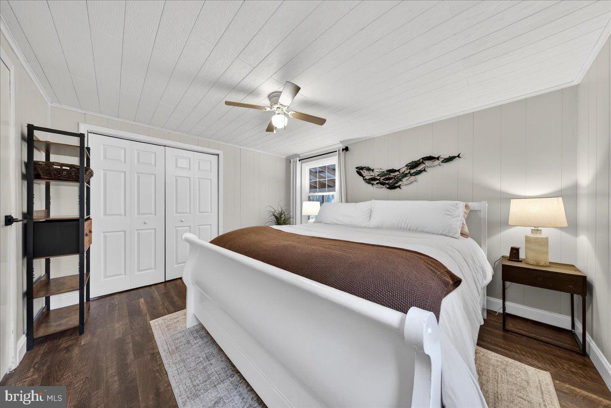 66 Ordinary Road Mineral, VA 23117 - Photo 32 of 96 a bedroom with a bed and a chandelier