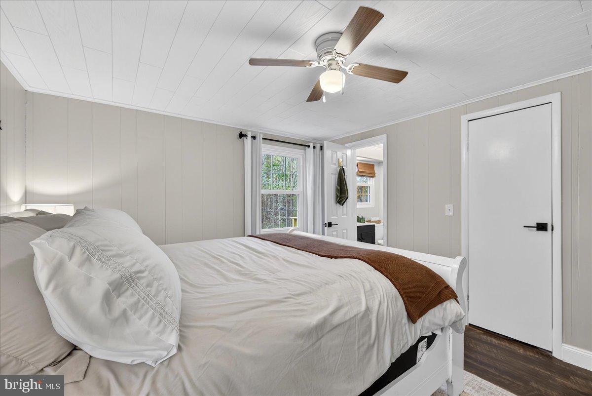 66 Ordinary Road Mineral, VA 23117 - Photo 34 of 96 a bedroom with a bed and a chandelier
