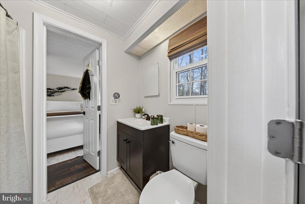 66 Ordinary Road Mineral, VA 23117 - Photo 37 of 96 a bathroom with a sink toilet and mirror