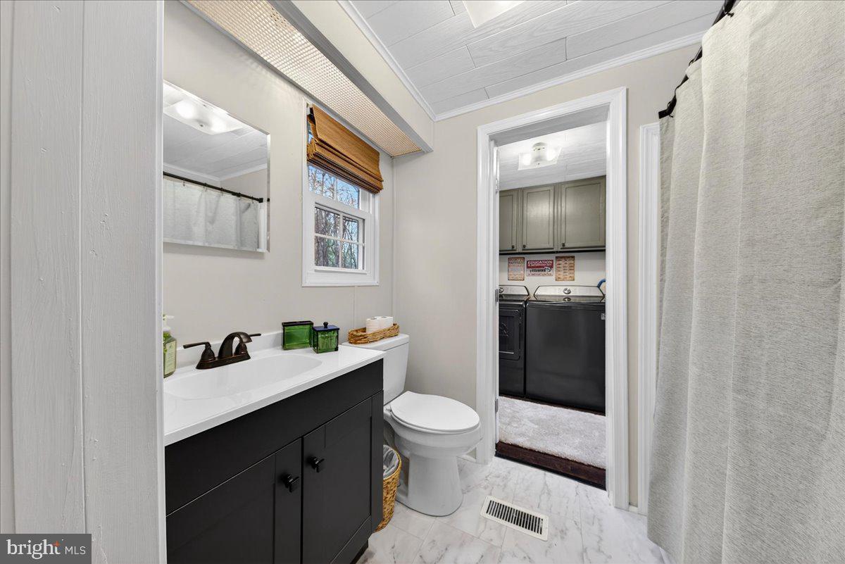 66 Ordinary Road Mineral, VA 23117 - Photo 38 of 96 a bathroom with a sink a toilet and shower