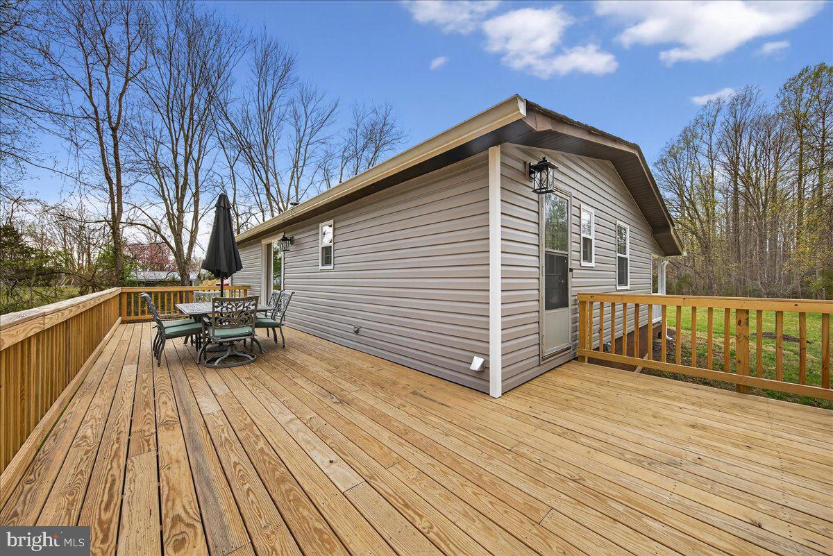 66 Ordinary Road Mineral, VA 23117 - Photo 45 of 96 a view of backyard with a deck and wooden floor