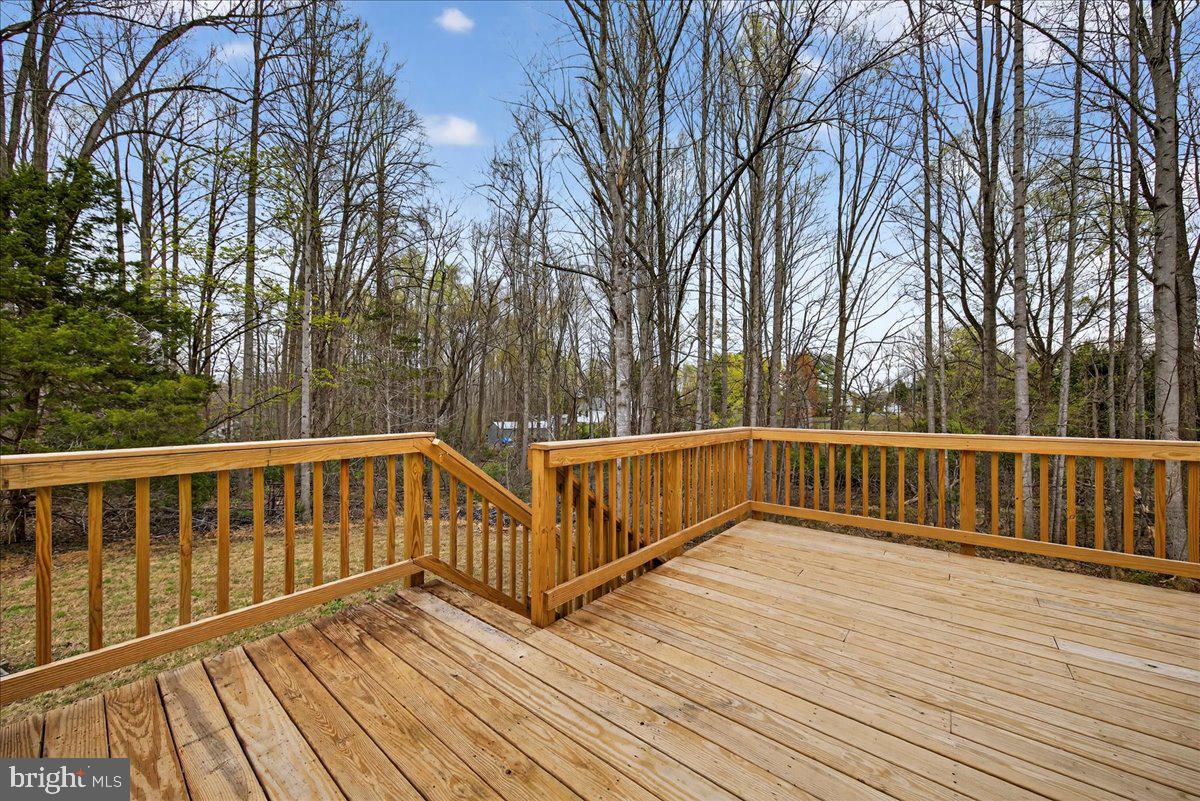 66 Ordinary Road Mineral, VA 23117 - Photo 46 of 96 a view of balcony with wooden floor and fence