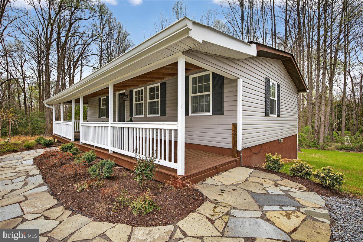 66 Ordinary Road Mineral, VA 23117 - Photo 6 of 96 a front view of a house with garden
