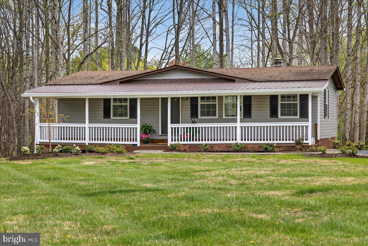 66 Ordinary Road Mineral, VA 23117 - Photo 65 of 96 a view of a brick house with a yard