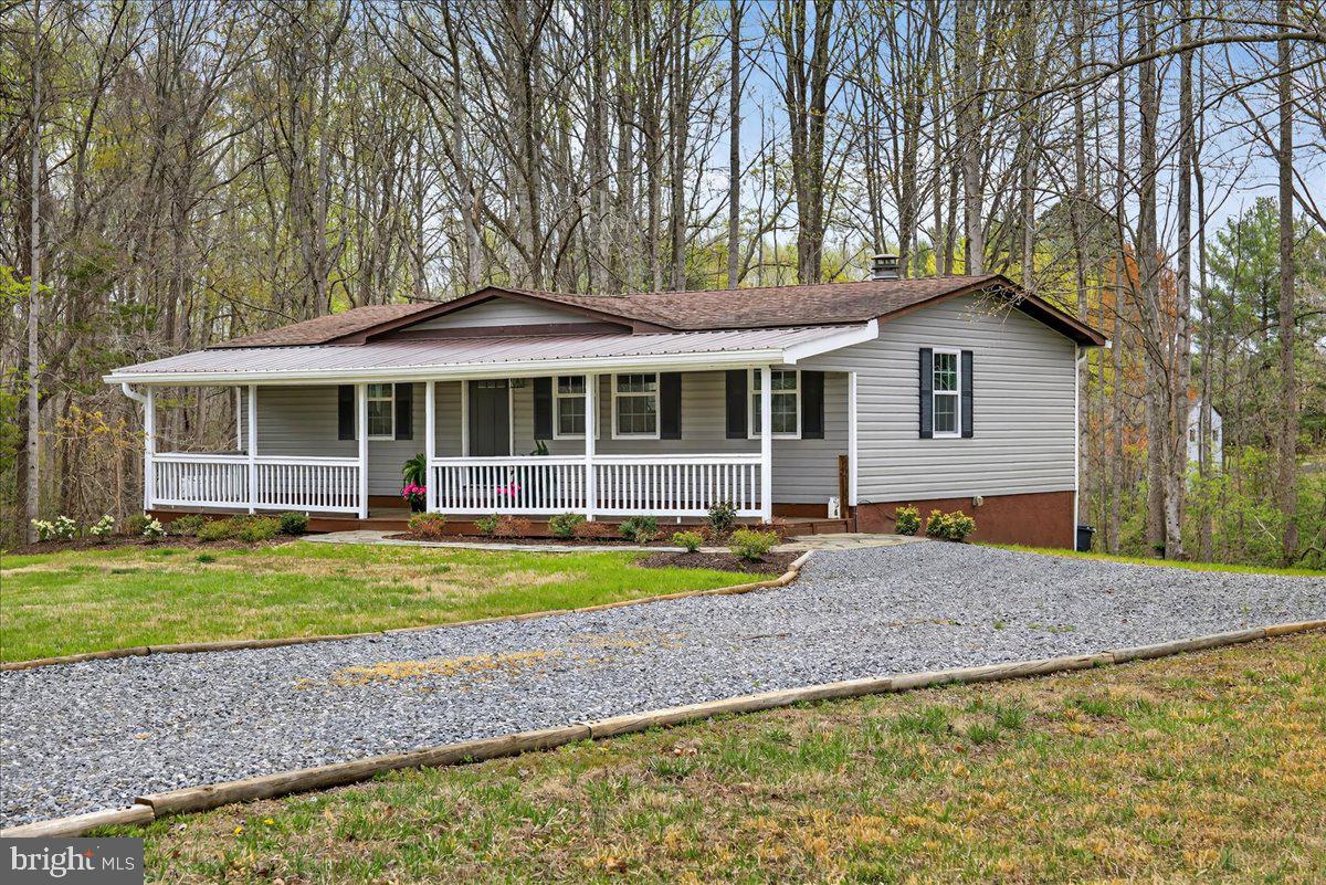 66 Ordinary Road Mineral, VA 23117 - Photo 67 of 96 a front view of a house with a garden