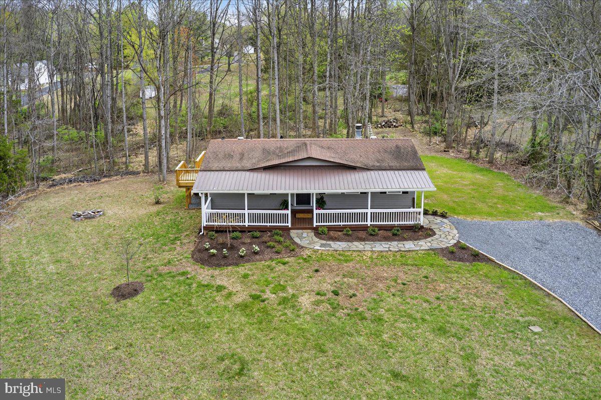 66 Ordinary Road Mineral, VA 23117 - Photo 69 of 96 a view of a house with a yard table and chairs