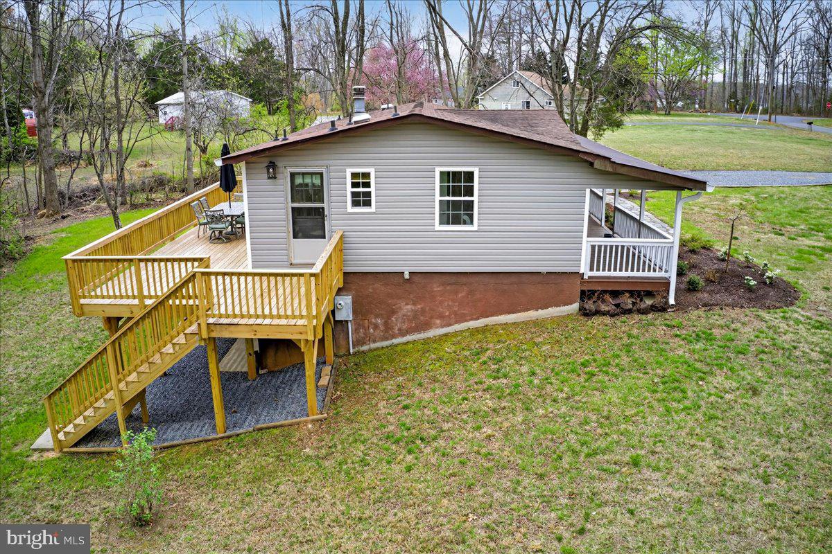 66 Ordinary Road Mineral, VA 23117 - Photo 74 of 96 a small house with a bench in the patio next to a yard