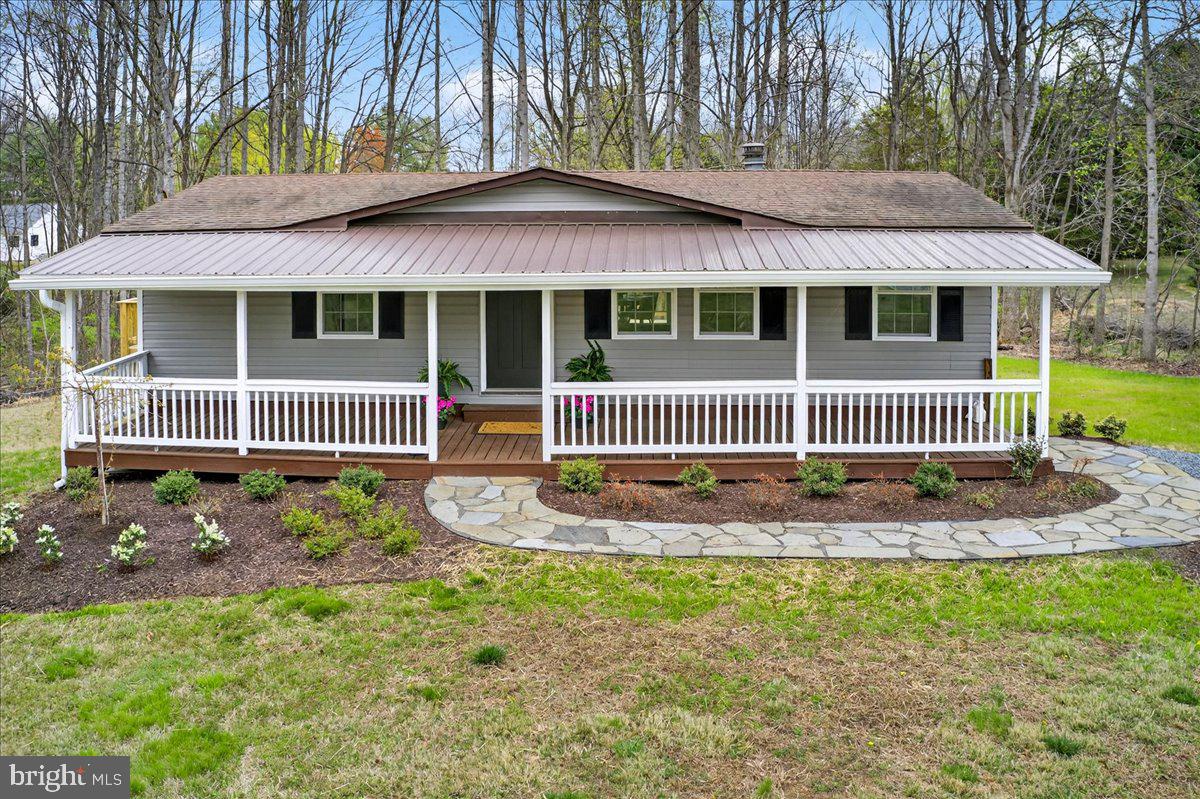 66 Ordinary Road Mineral, VA 23117 - Photo 77 of 96 a front view of a house with a garden