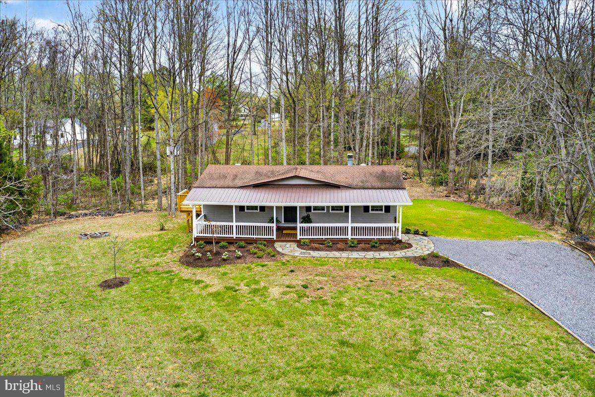 66 Ordinary Road Mineral, VA 23117 - Photo 78 of 96 a view of a house with a yard table and chairs