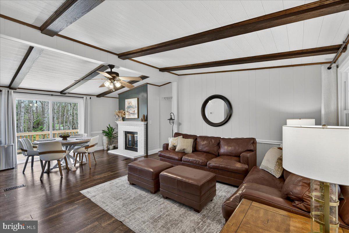 66 Ordinary Road Mineral, VA 23117 - Photo 9 of 96 a living room with furniture a fireplace and wooden floor