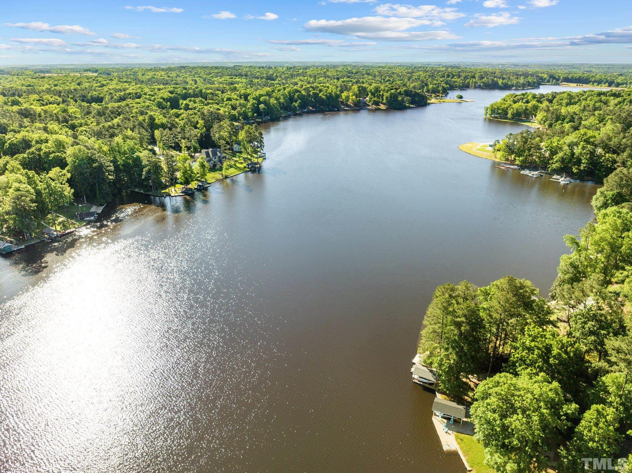 147 Shaman Drive Spring Hope, NC 27882 - Photo 3 of 5 a view of a lake with a mountain in the background