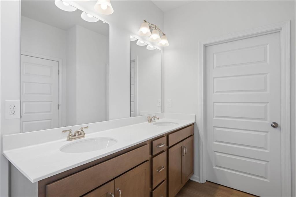 22 Willow Circle Rock Spring, GA 30739 - Photo 31 of 41 a bathroom with a sink vanity and a mirror