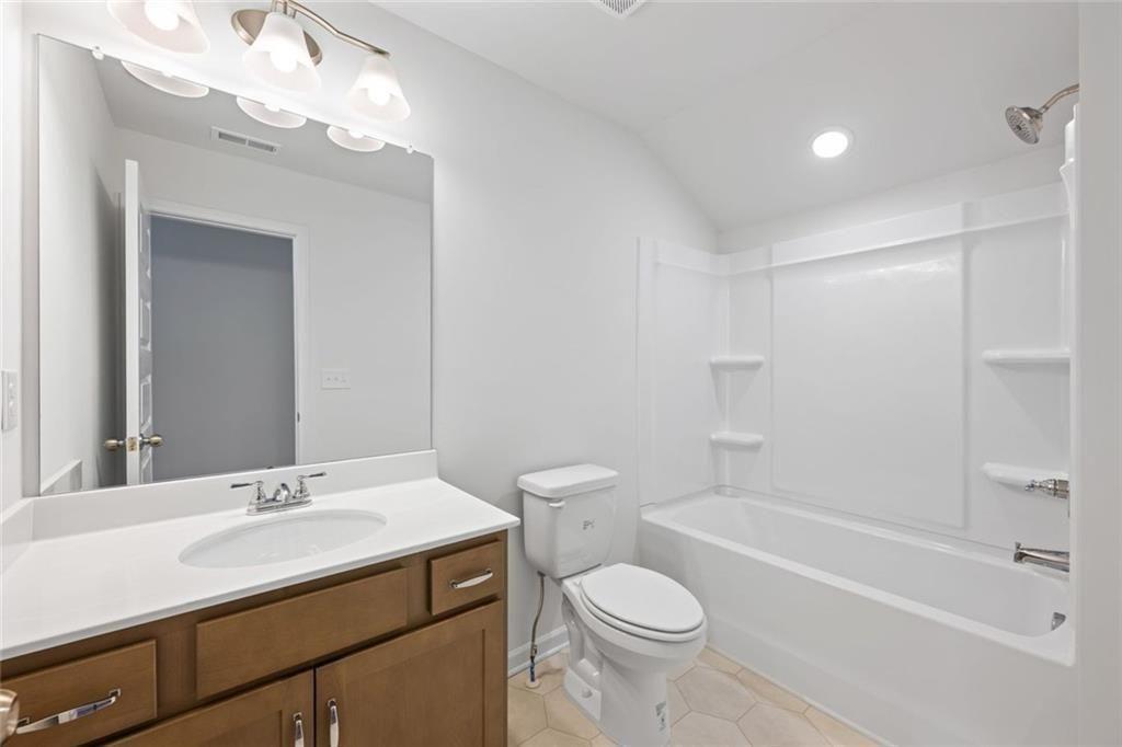 22 Willow Circle Rock Spring, GA 30739 - Photo 8 of 41 a bathroom with a sink a toilet and shower