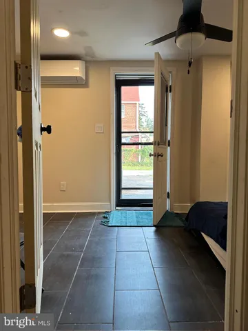 a bathroom with a tub shower and a sink