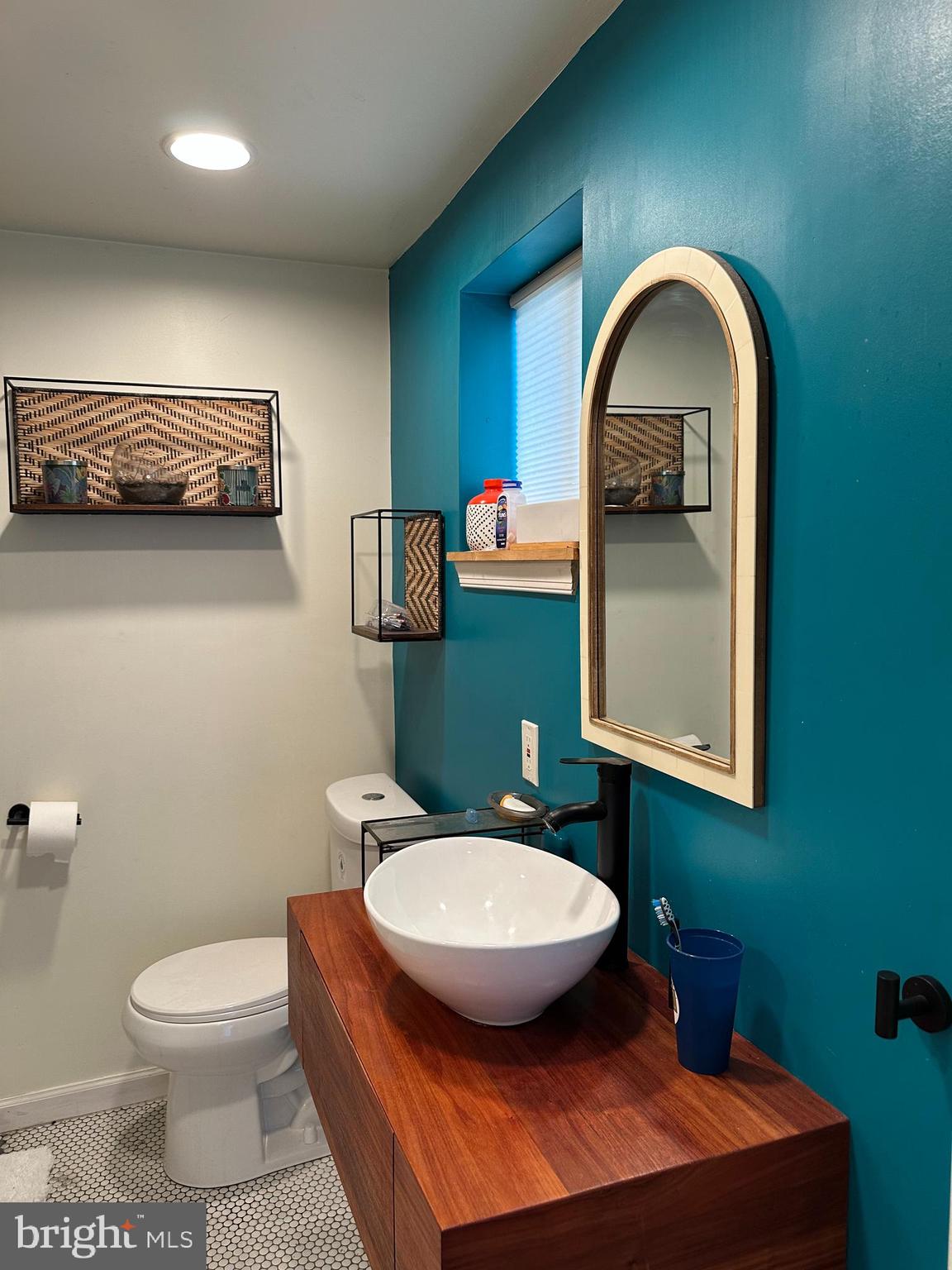 30 East Providence Road Lansdowne, PA 19050 - Photo 15 of 33 a bathroom with a toilet a sink and mirror