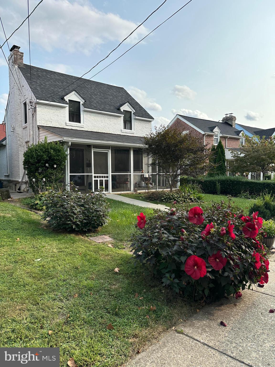 30 East Providence Road Lansdowne, PA 19050 - Photo 2 of 33 a front view of a house with a big yard and potted plants