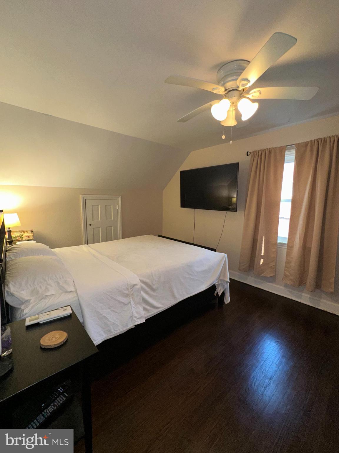 30 East Providence Road Lansdowne, PA 19050 - Photo 25 of 33 a bedroom with a bed and a chandelier