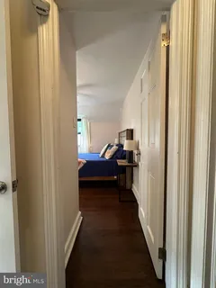 a view of a bedroom from a hallway