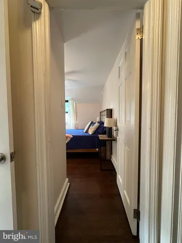 a view of a bedroom from a hallway