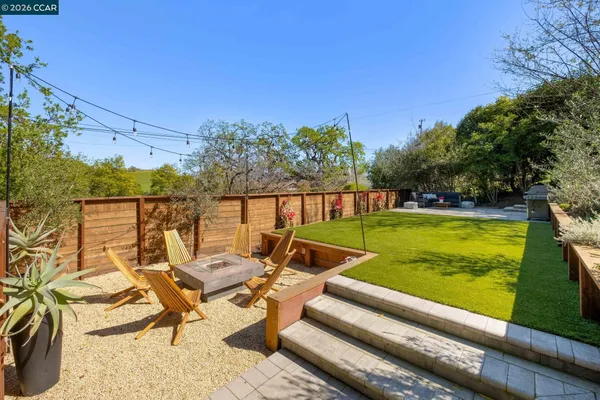a view of swimming pool with outdoor seating
