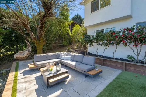 a outdoor living space with furniture and a potted plant