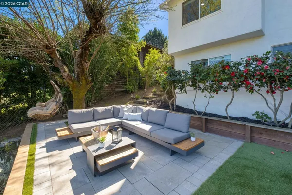 a outdoor living space with furniture and a potted plant