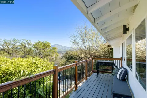 a view of balcony with furniture