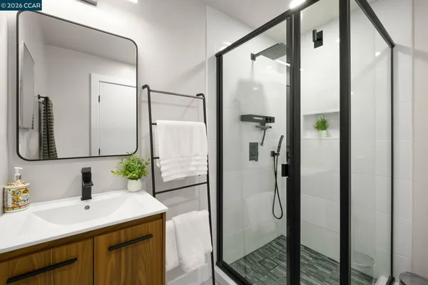 a bathroom with a sink and mirror
