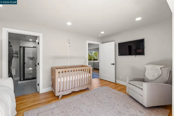 a bedroom with furniture and a window