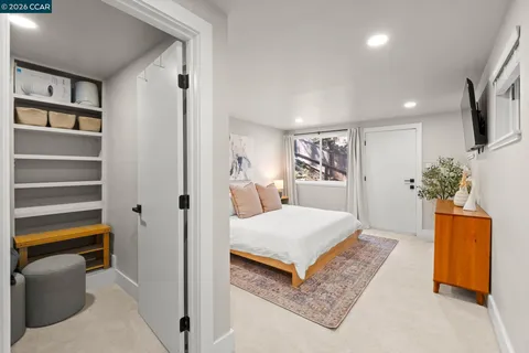 a bedroom with a bed and a dresser