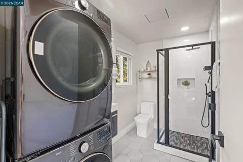 a bathroom with a toilet a sink and a mirror