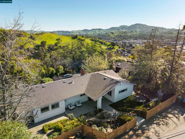 an aerial view of a house with a garden