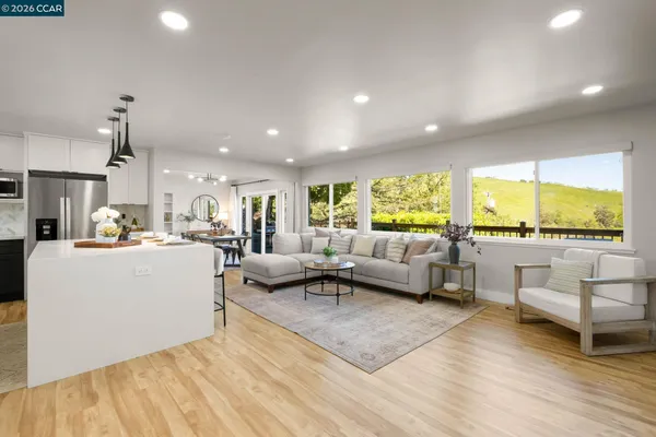 a living room with furniture and a large window