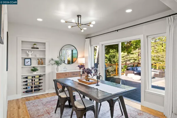 a view of a dining room with furniture window and outside view