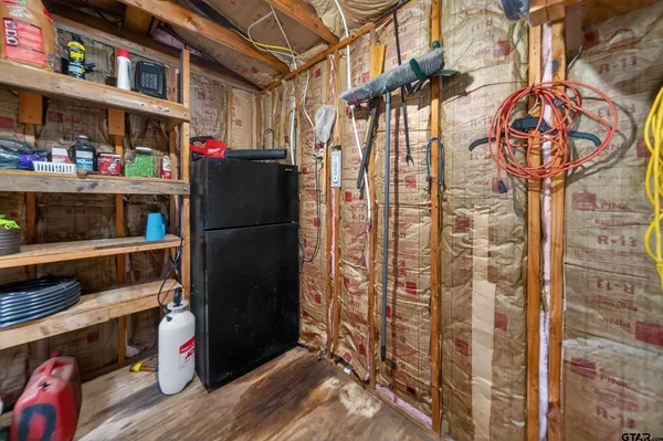 a refrigerator freezer sitting inside of a kitchen