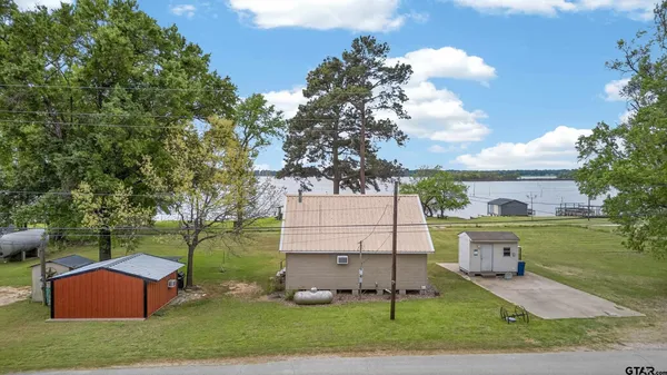 an aerial view of a house with outdoor space
