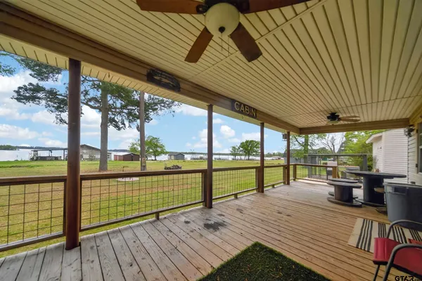 a view of a patio with wooden floor