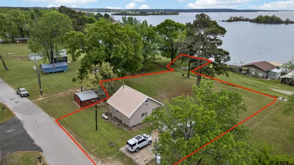an aerial view of a house having yard