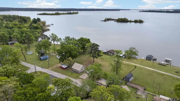 an aerial view of house with yard swimming pool and outdoor seating