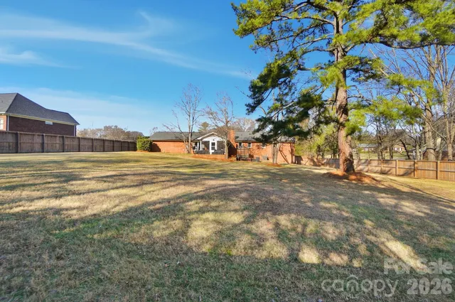 a view of an empty room with a small yard