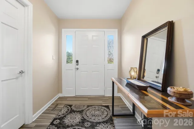 a room with a table and a mirror