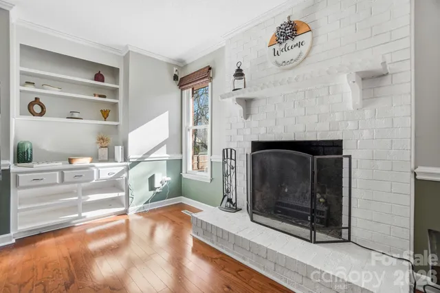 a view of a livingroom with furniture and a fireplace
