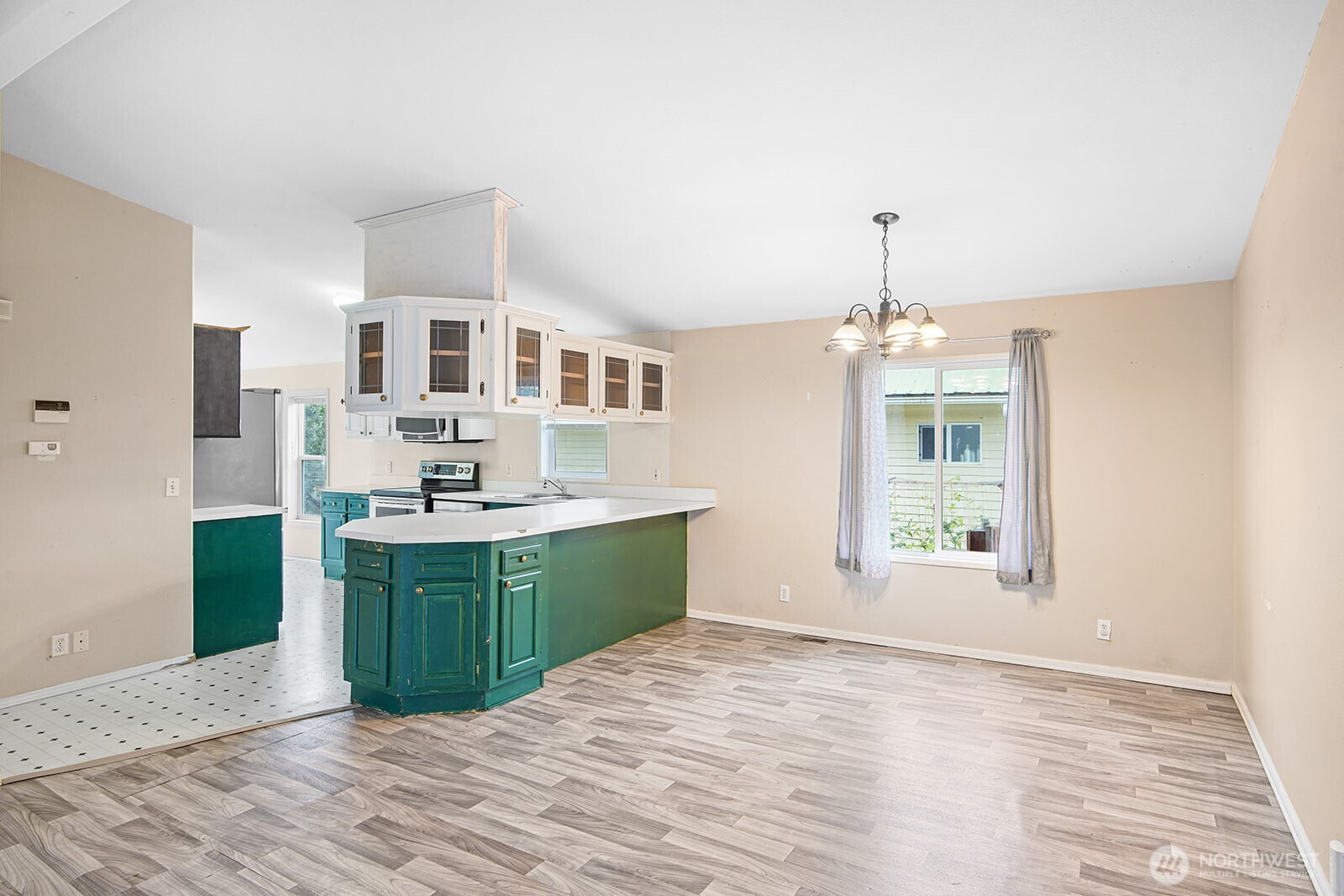 124 South 6th Street McCleary, WA 98557 - Photo 12 of 33 a kitchen with kitchen island a sink appliances and cabinets