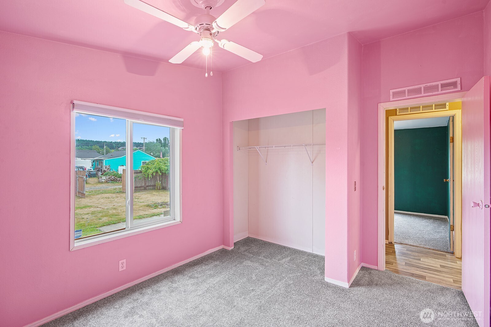 124 South 6th Street McCleary, WA 98557 - Photo 14 of 33 an empty room with a window and a kitchen
